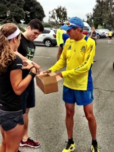 Mike Rouse handing out "Boston Strong" pins