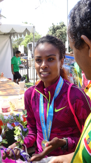 Genzebe chatting with media following her win.