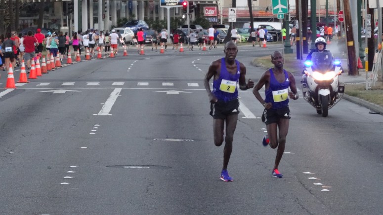 Peter Kirui (#2) and Nicholas Kemboi along Ala Moana Blvd.