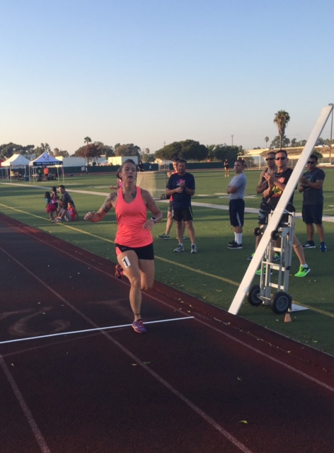 Aviation ordnance Petty Officer 1st class Natasha Swartley takes second in the women's mile in PR 6:52.16.