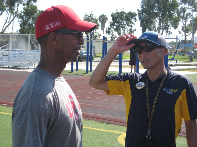 Coach Adam Henderson consults with base rec manager Kota Henmin